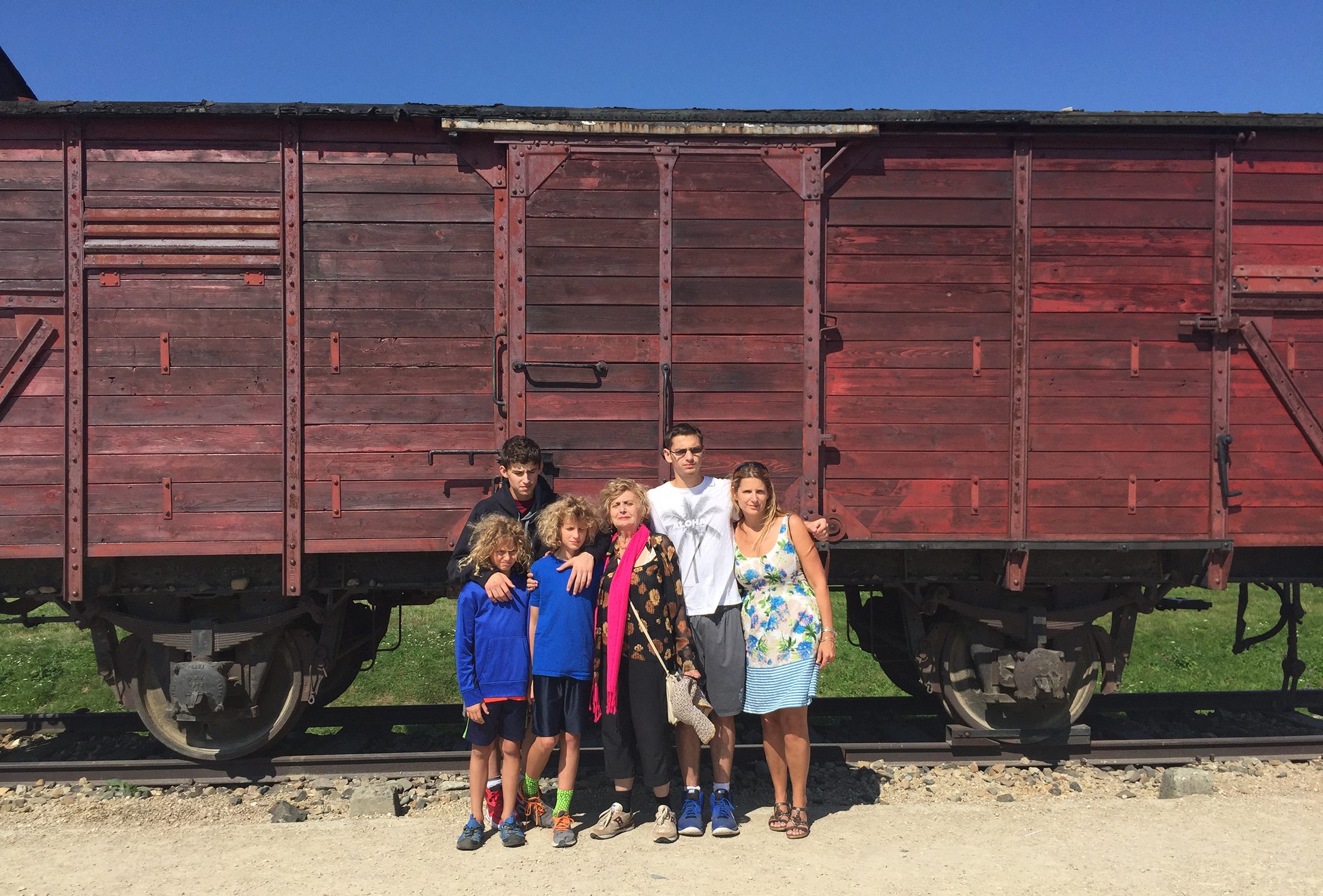 Tova returns to Auschwitz in 2016 with her daughter Itaya and four grandchildren.